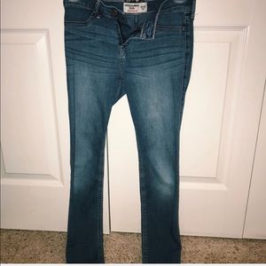 well fitted dark blue jeans